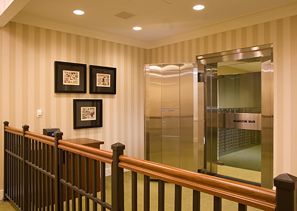 Bank vault interior. Striped gold and cream wallpaper.