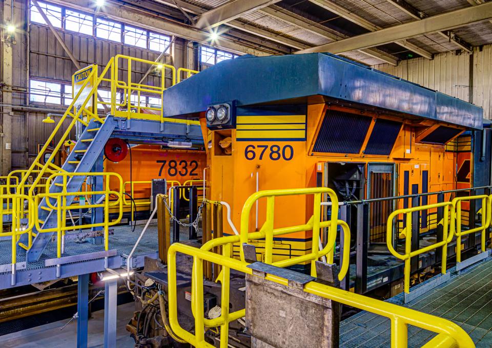 Train caboose within the way bay as seen from maintenance platform