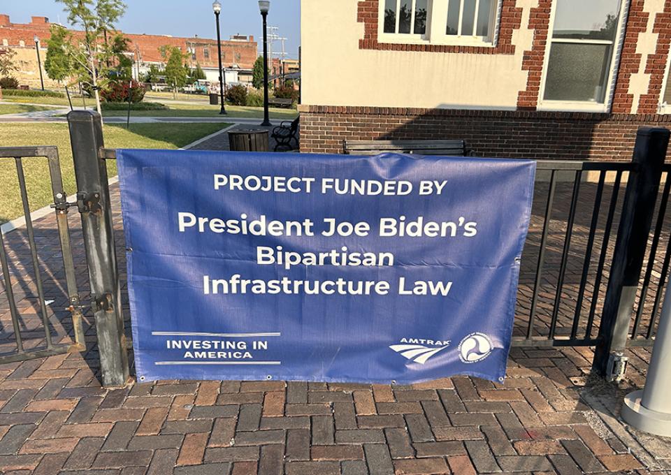 Fence with President Joe Biden Bipartisan Infrastructure Law sign
