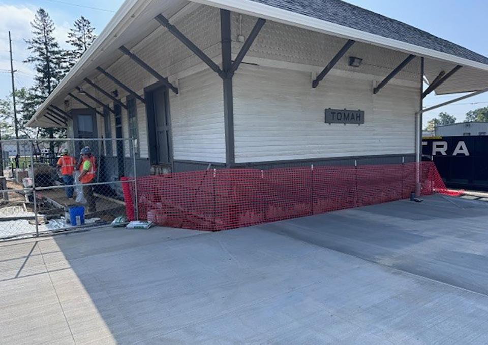 Station exterior. New concrete platform.